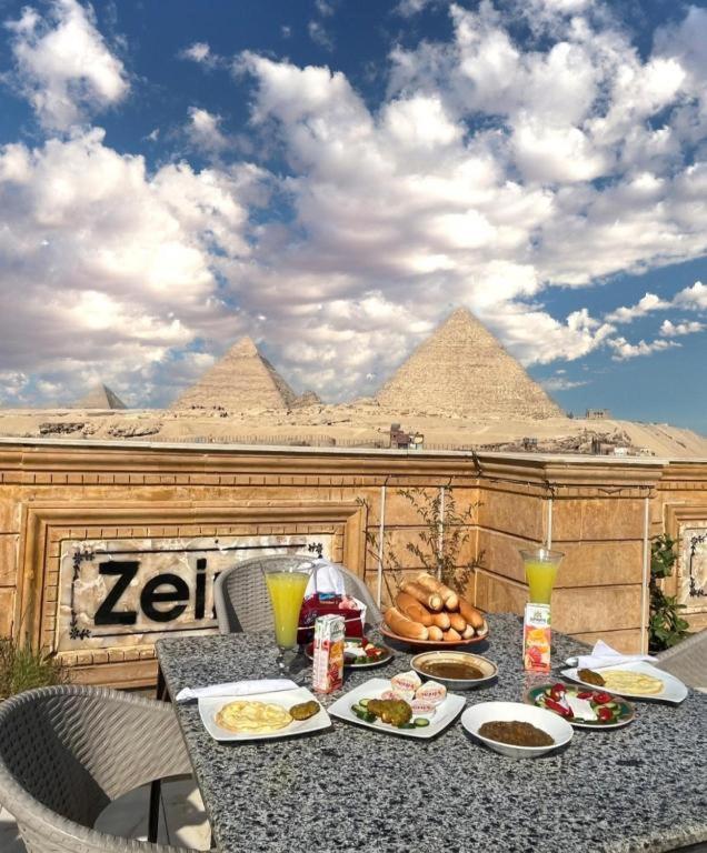 Al Kawm al Akhdar Queen Isis Pyramids View מראה חיצוני תמונה
